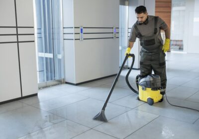 full-shot-man-vacuuming-office-floor