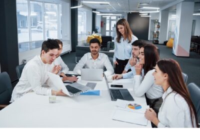 showing-good-results-group-young-freelancers-office-have-conversation-smiling