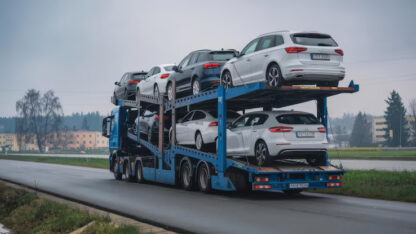 cars-carrier-truck-asphalt-road-poland-truck-transporter_1368855-14941