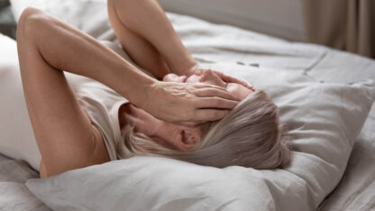 stress-blocks-middle-aged-woman-potentially-suffering-from-insomnia-from-falling-asleep-in-bed