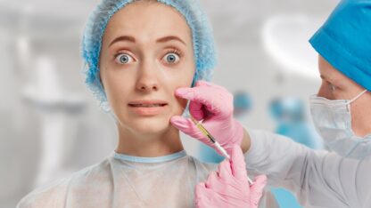 young-woman-wearing-medical-headwear-while-doctor-injects-her-face