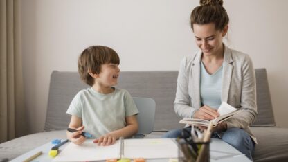 front-view-child-being-tutored-home-by-woman-1