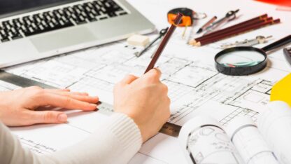 architect-drawing-blueprint-with-pencil-1